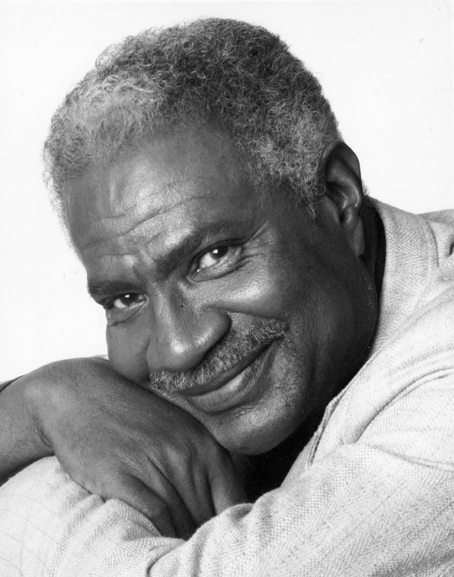A black and white headshot of Ossie Davis